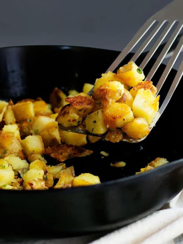 Skillet_Potatoes_on spatula in_a_Cast_Iron_Skillet