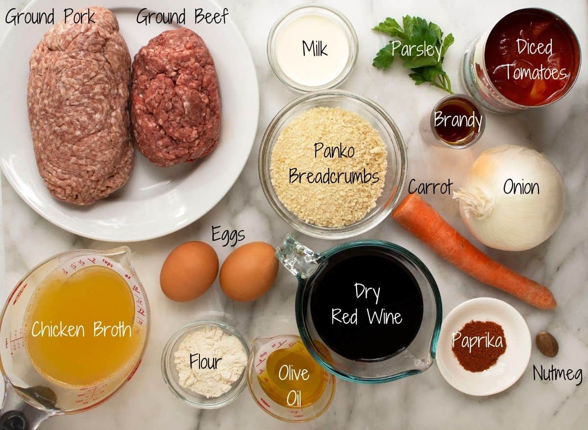 Spanish Meatballs Ingredients on a white marble board