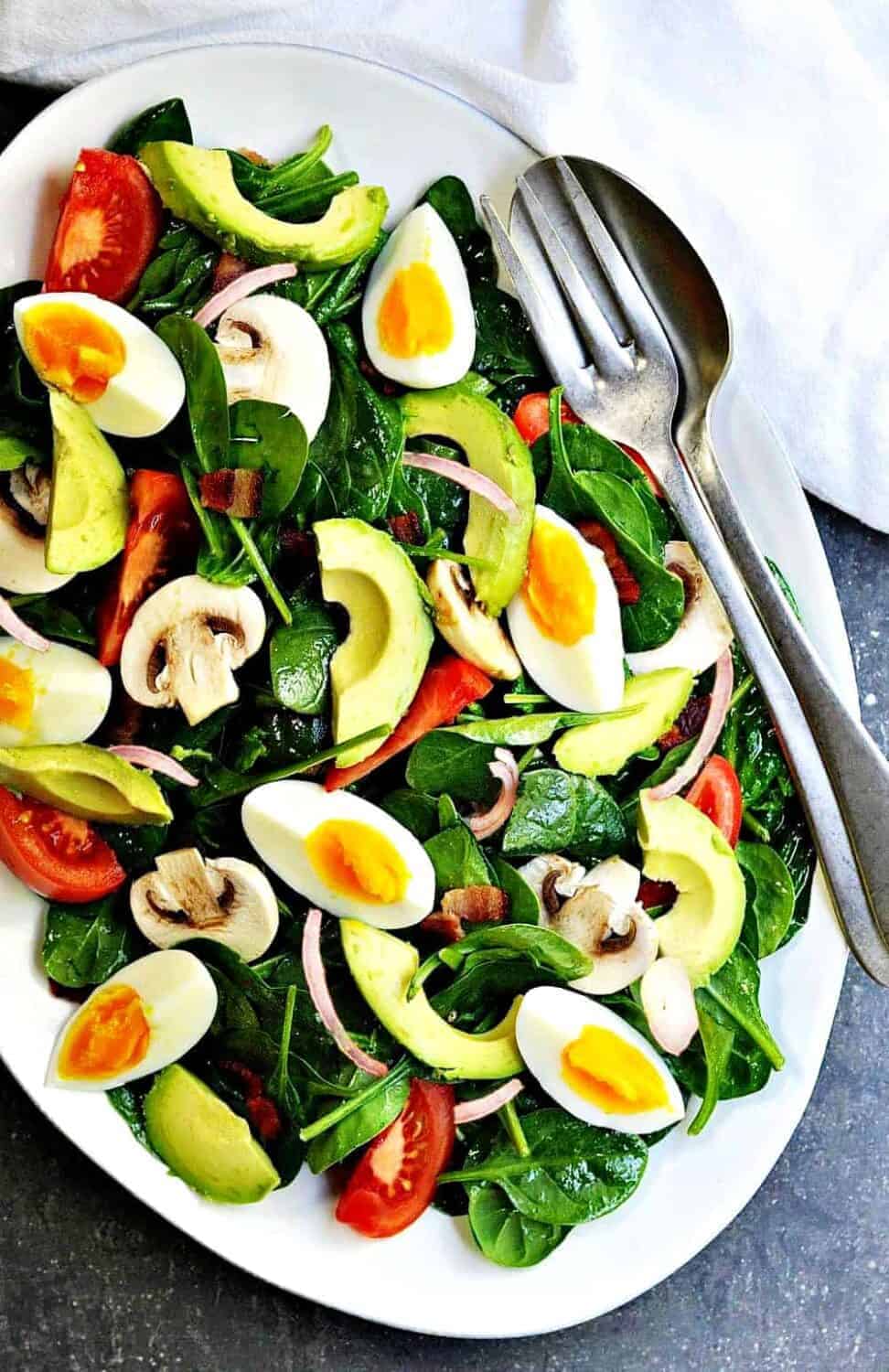 Spinach-Salad served on a white platter