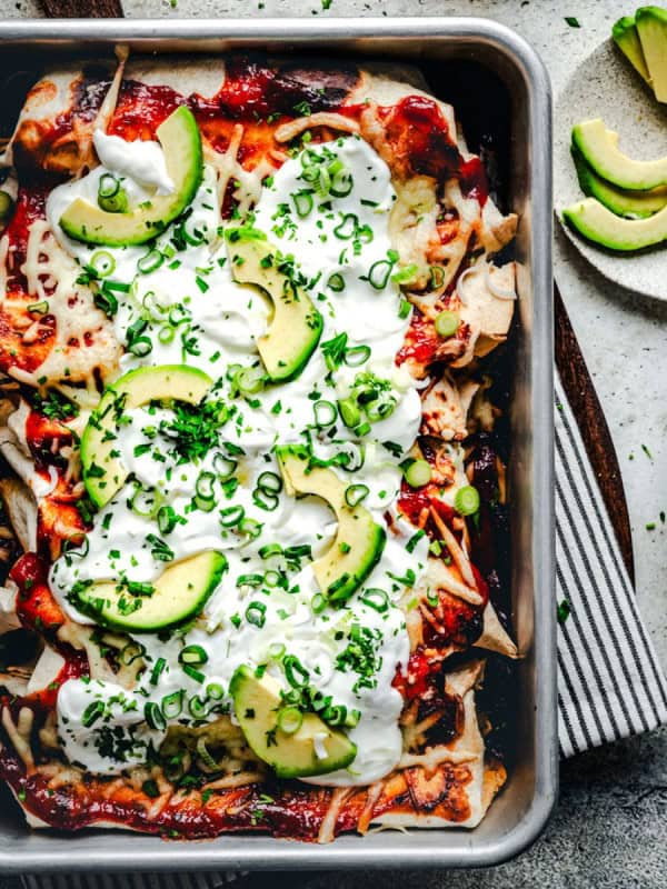 Fully baked steak enchiladas in baking pan.