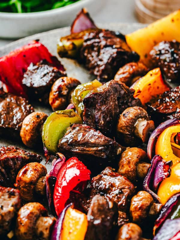 Steak Kabobs that were cooked in the Oven served on a gray ceramic plate.