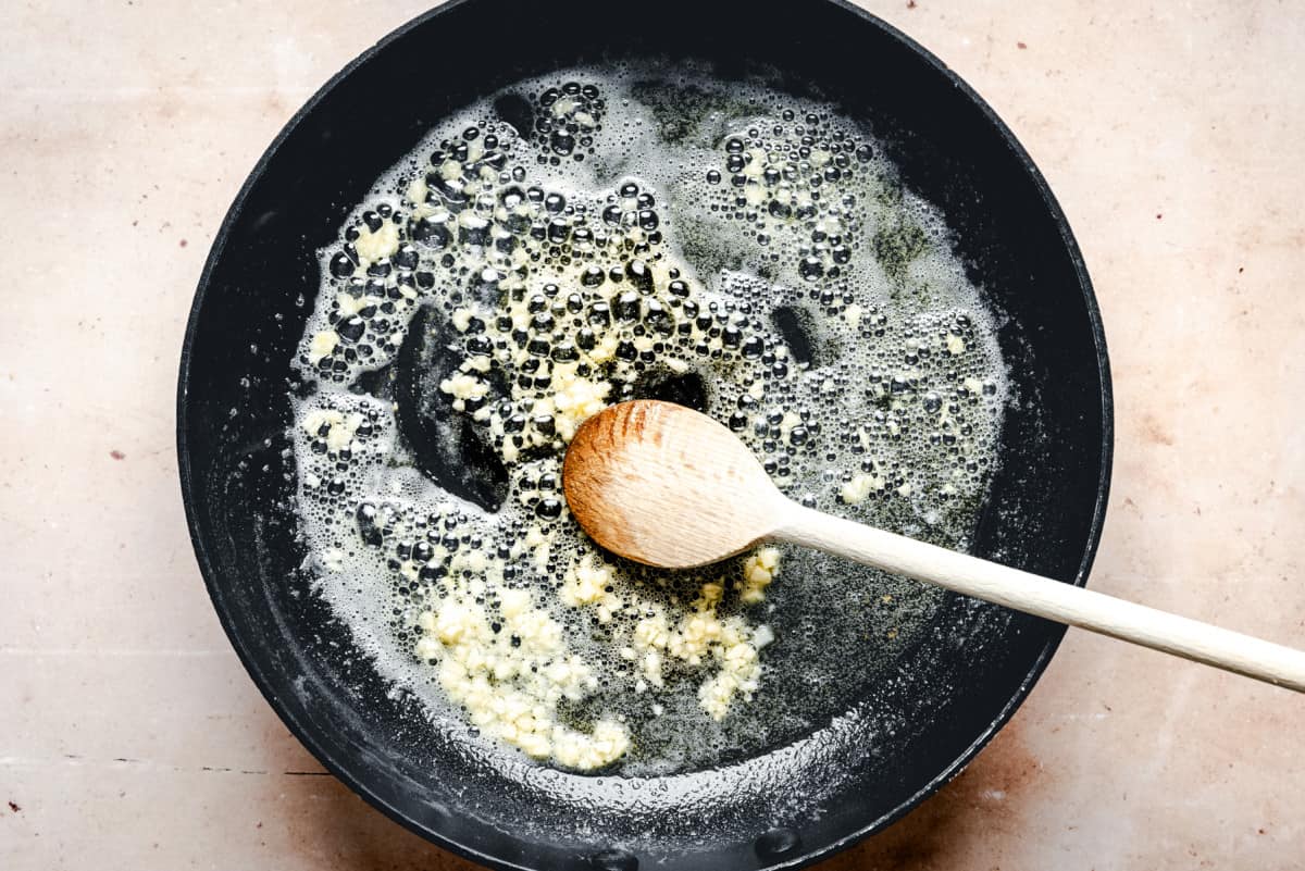 cooking garlic in butter in skillet.