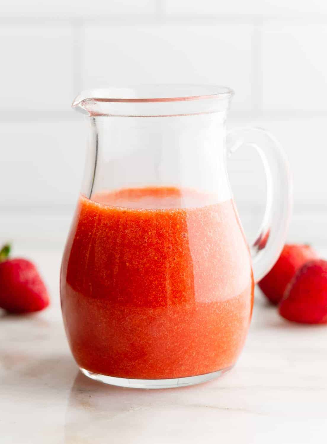 Strawberry Vinaigrette in a clear glass pitcher