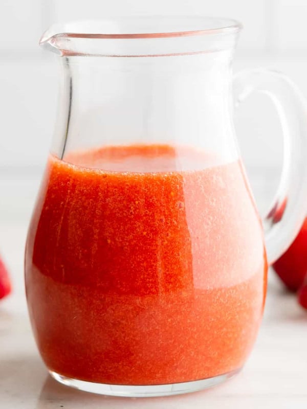 Strawberry Vinaigrette in a clear glass pitcher