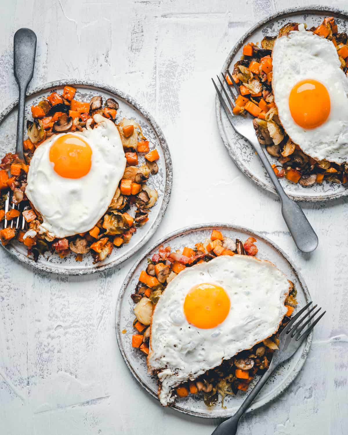 Three plates of Sweet Potato Hash from above.