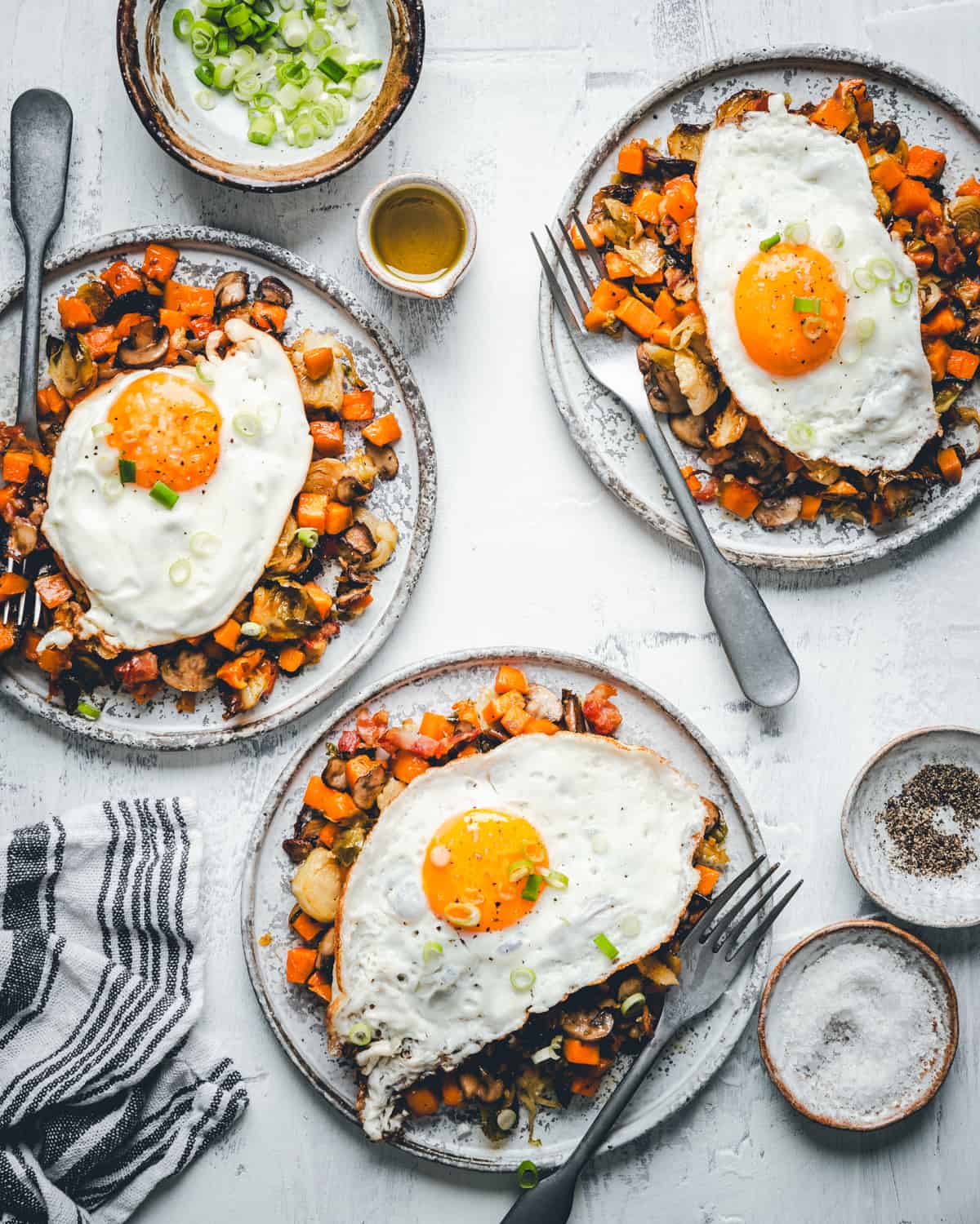 Sweet Potato Hash from above with sliced onions in a bowl.