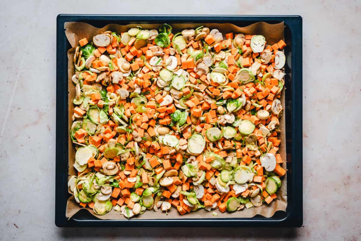 Sweet Potato Hash ingredients spread on baking sheet.