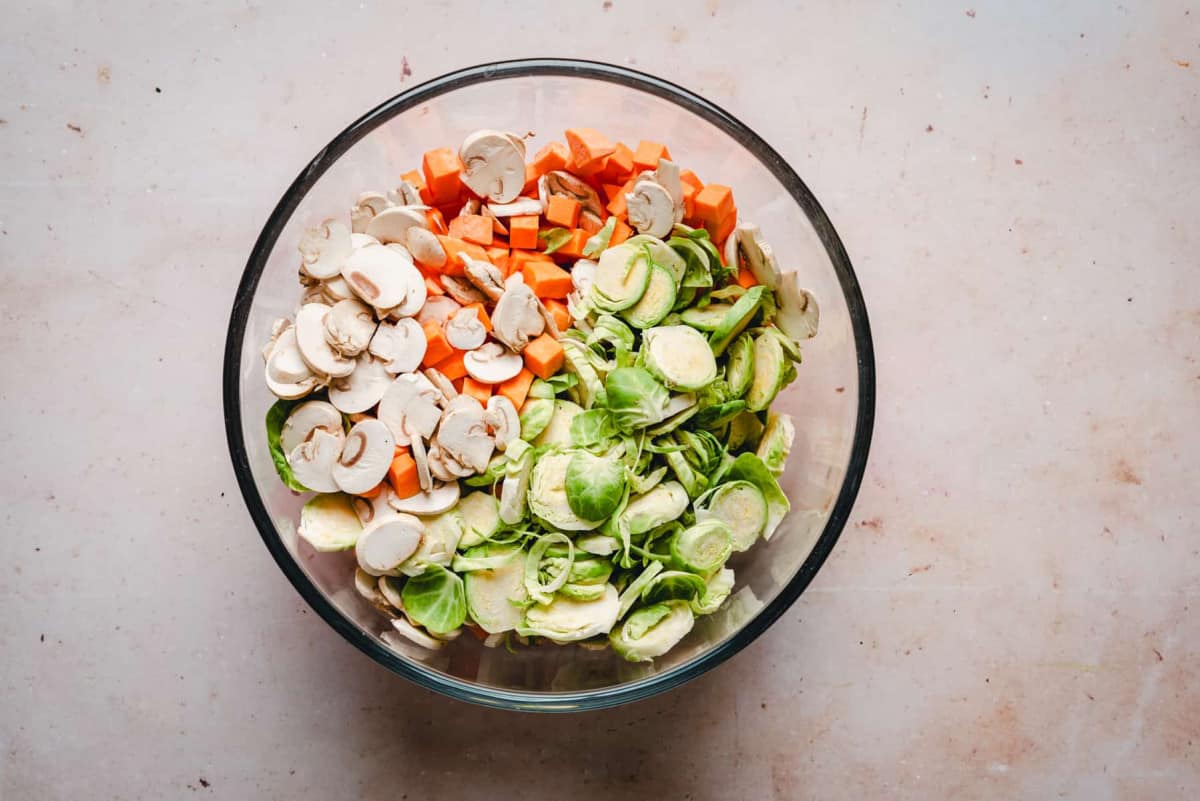 Sweet Potato Hash vegetables mixed in glass bowl.