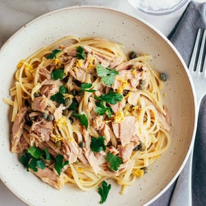 tuna pasta served in an off-white ceramic bowl..