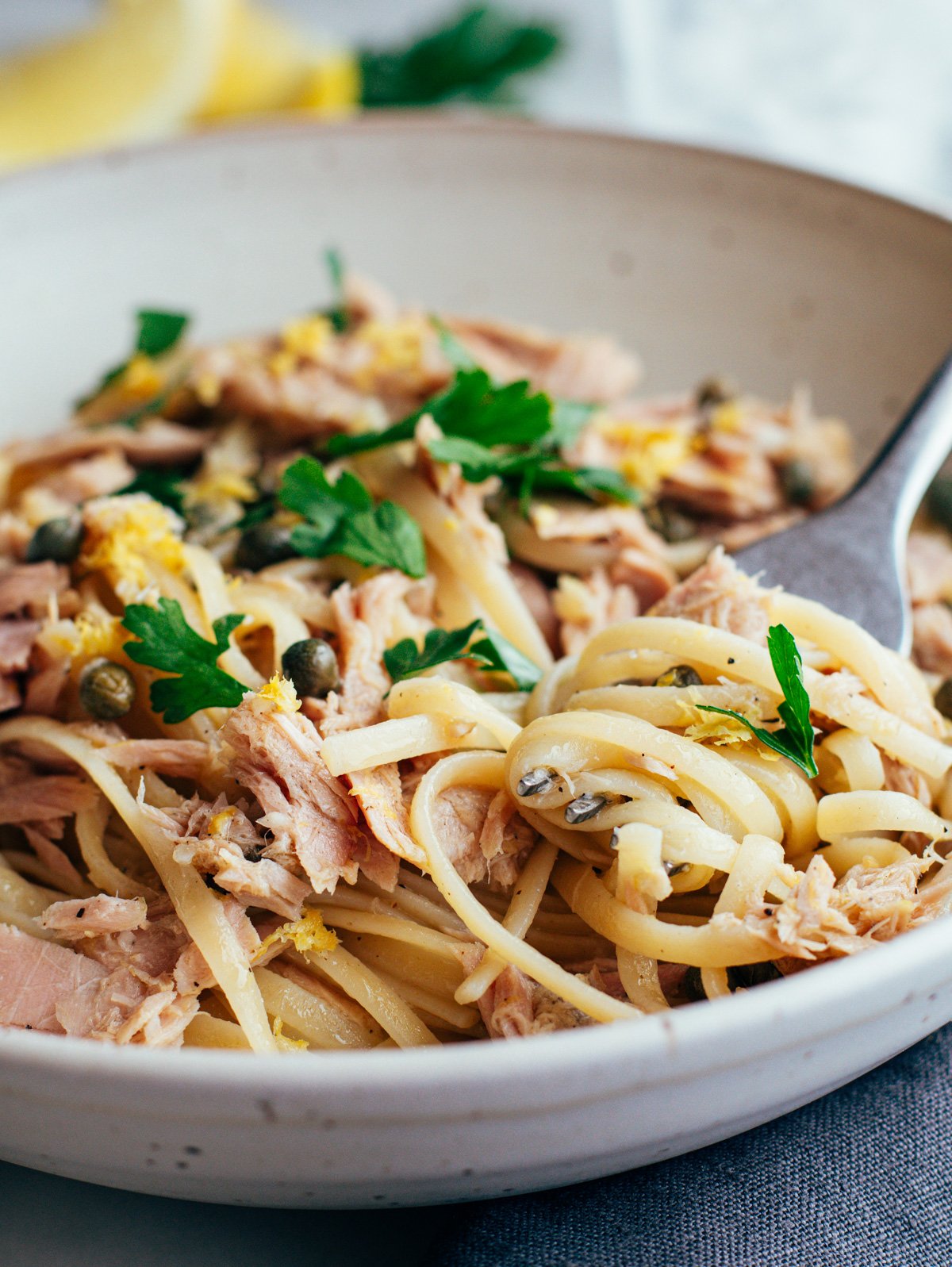 tuna pasta served in an off-white ceramic bowl.