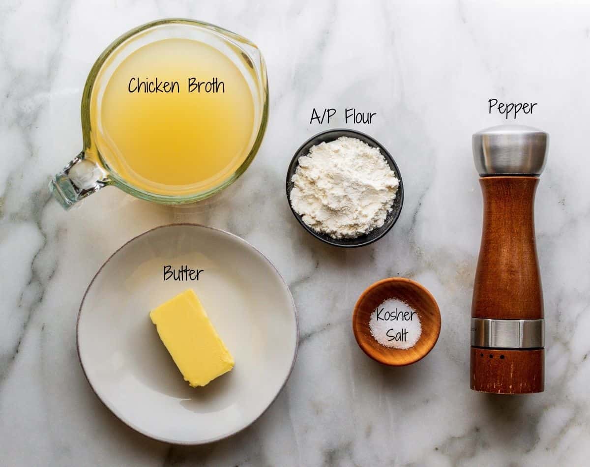 Turkey Gravy without Drippings Ingredients on a white marble board.