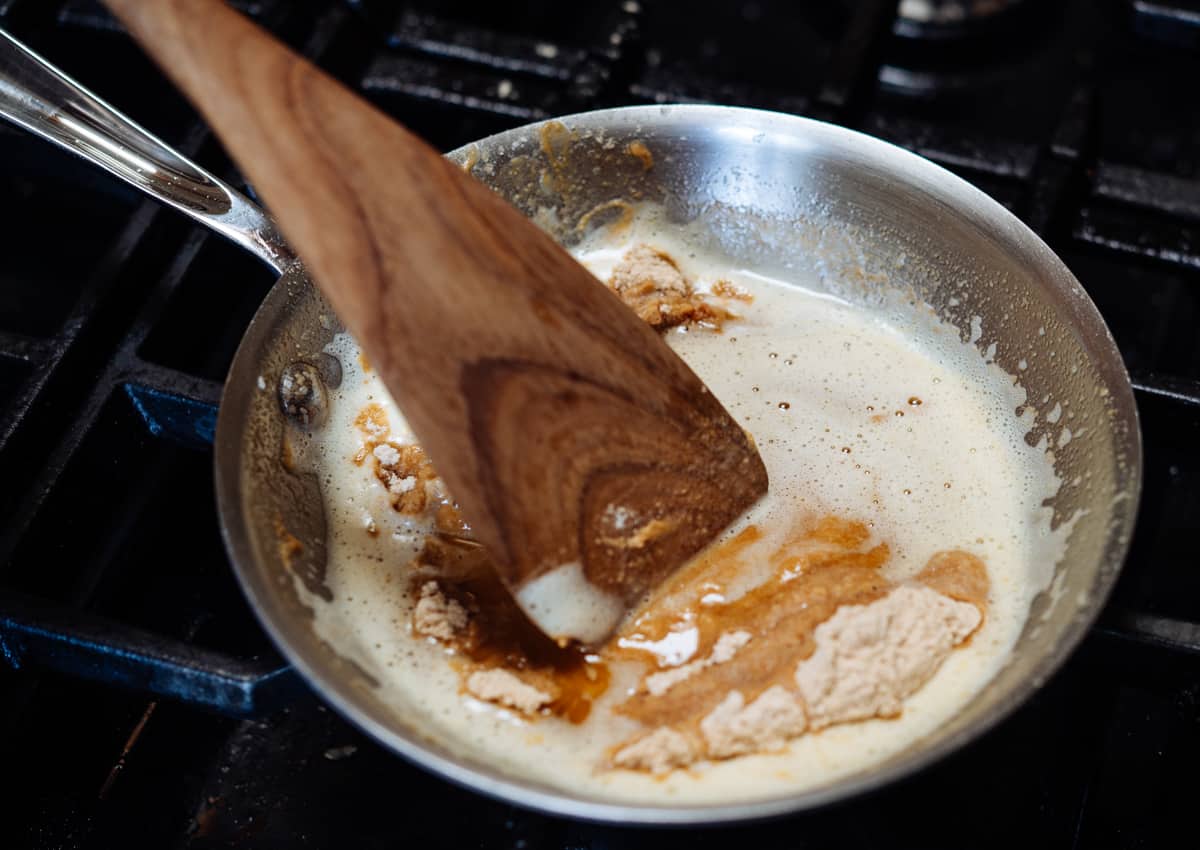 adding toasted flour to brown butter.