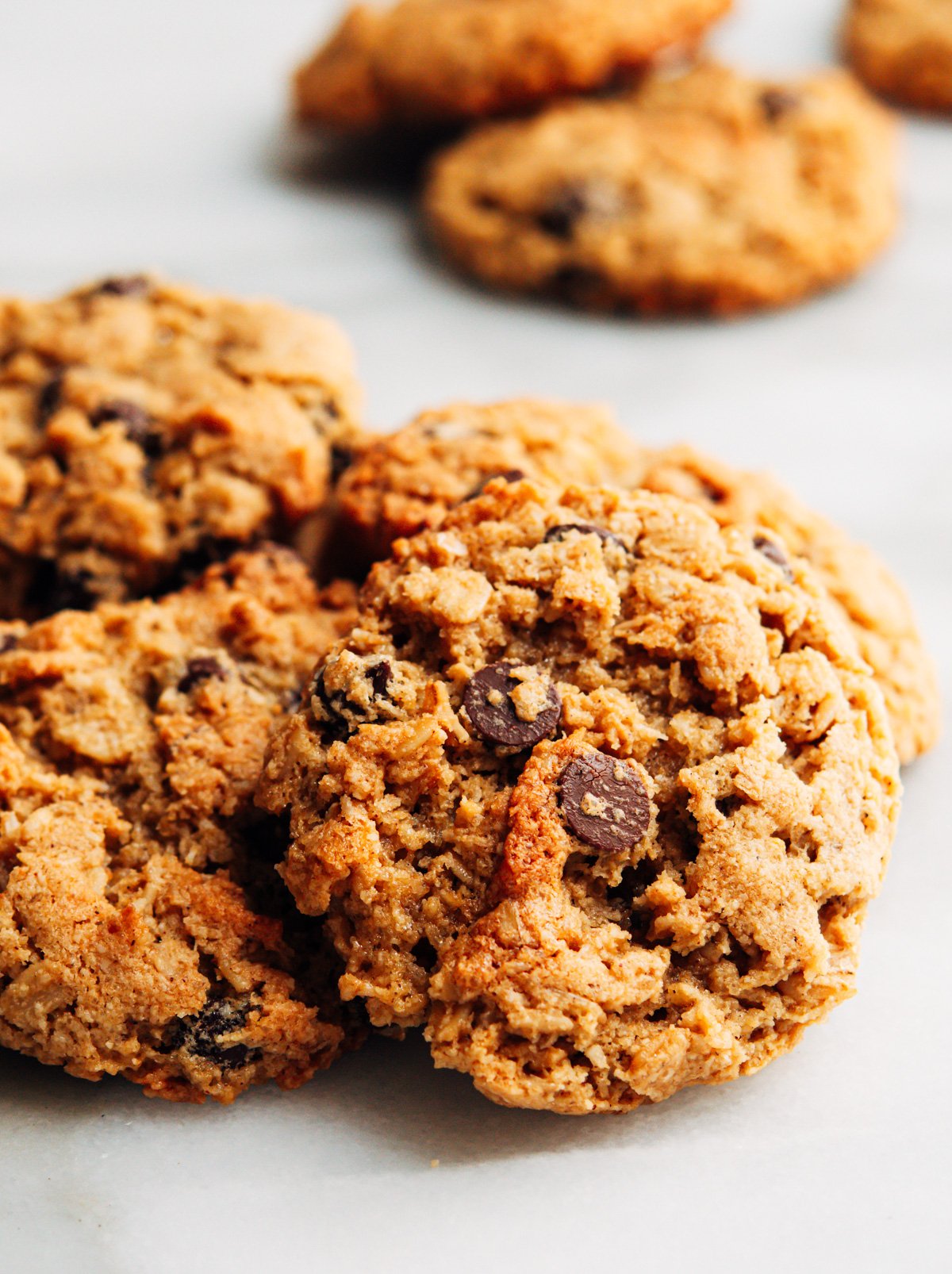 Almond Flour Oatmeal Cookies stacked on a white marble board