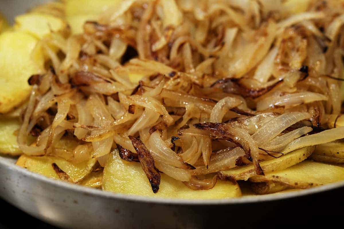 caramelized onions added to pan fried potatoes