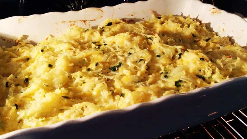 cheesy potatoes baking in the oven