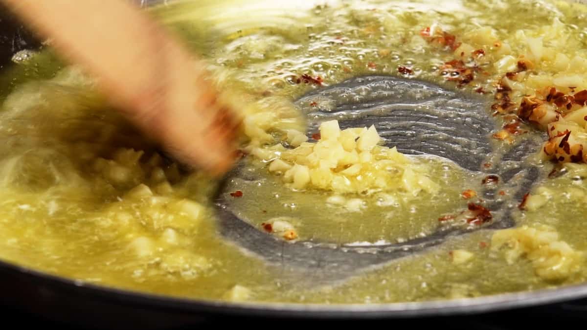 cooking garlic and red pepper flakes in butter in skillet.