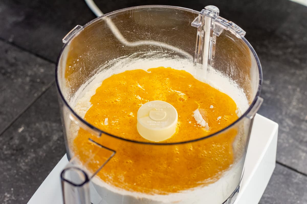 egg and oil mixture added to flour and salt in food processor bowl