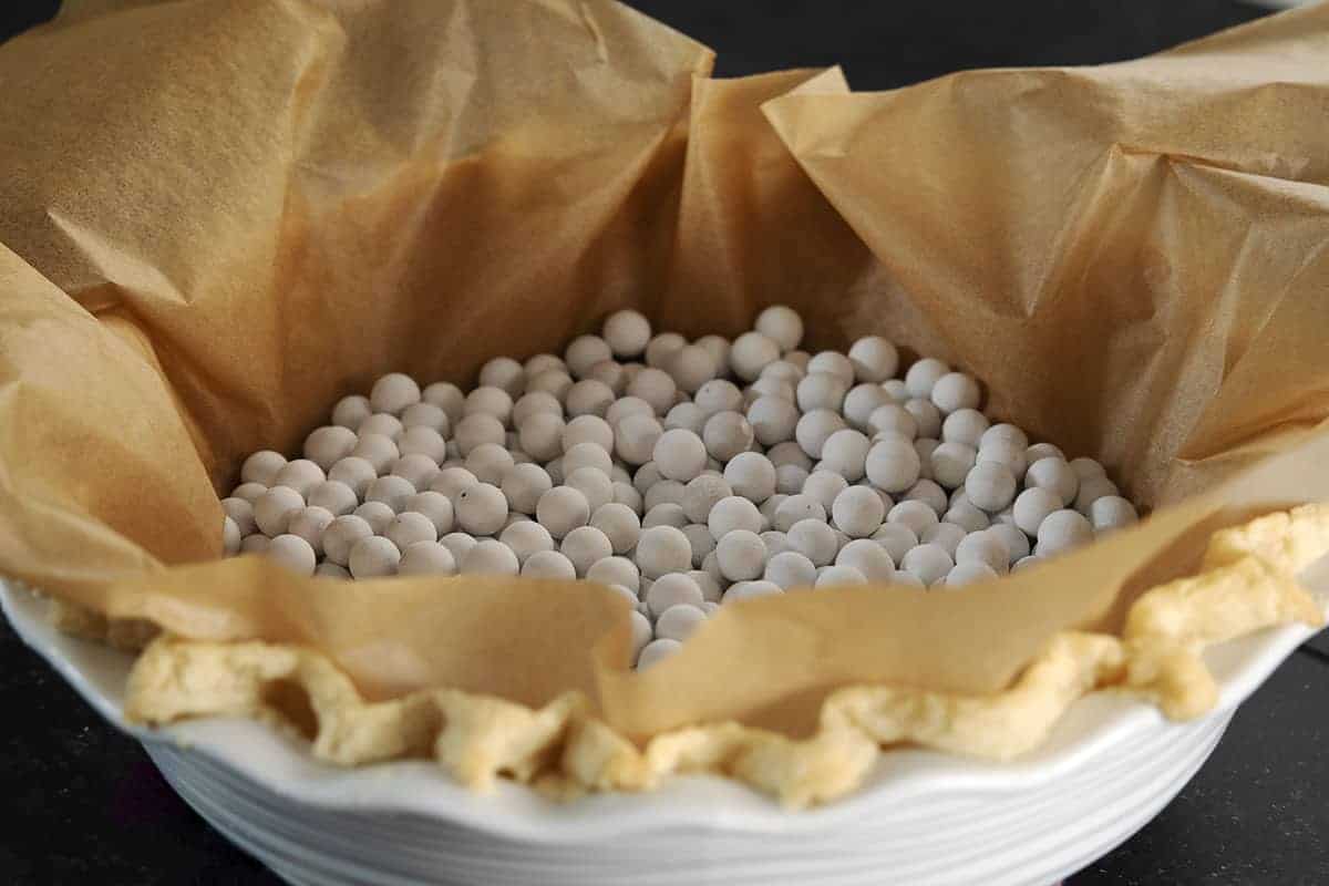 lard pie crust baked with parchment and pie weights