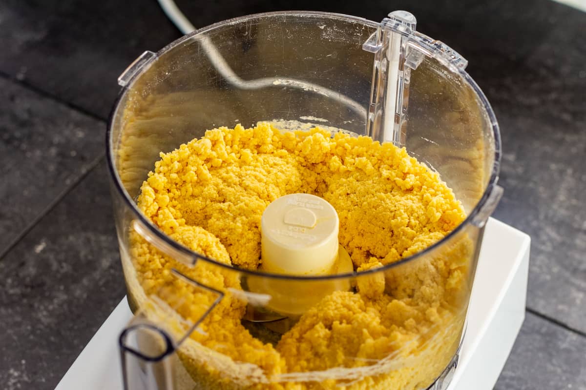 pasta dough ingredients starting to gather into a ball