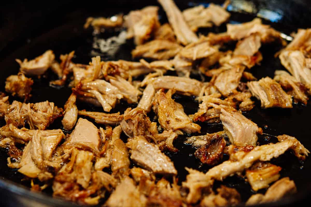 pulled pork crisped in a cast iron skillet