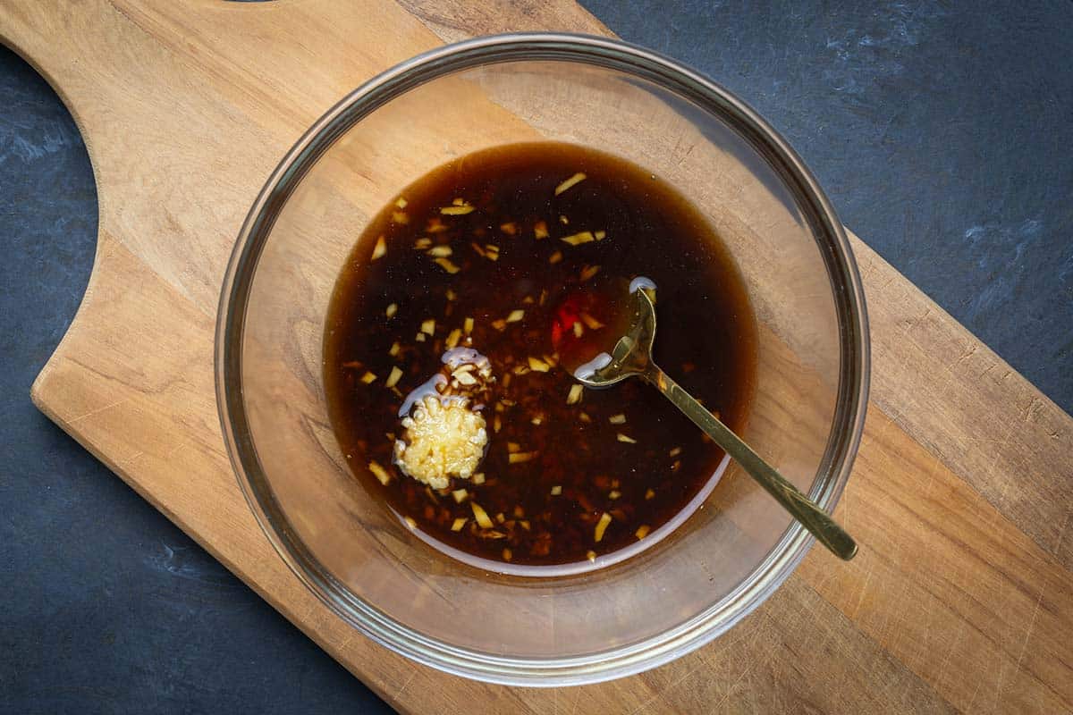 salad dressing ingredients in a glass bowl.