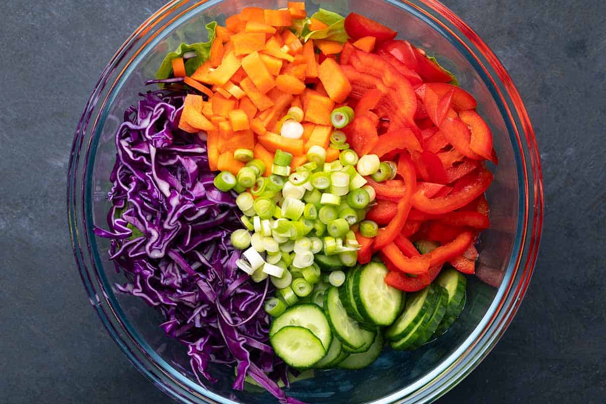 salad ingredients in a glass bowl.