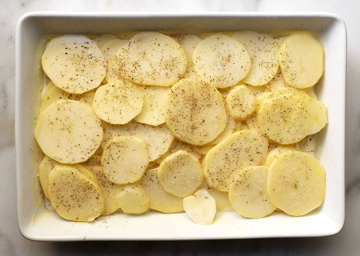 second layer of sliced potatoes in baking dish