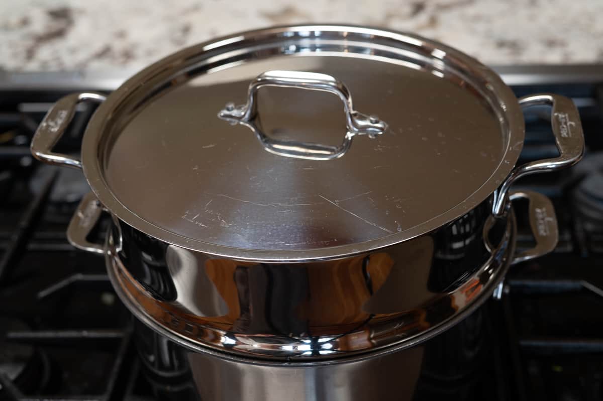 steaming potatoes in a large steamer.